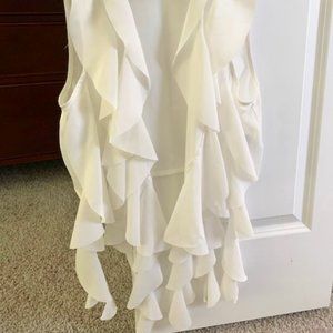White cascading ruffle vest